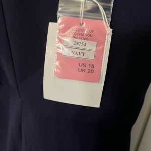 Navy blue bridesmaids dress. Brand new with tags. Never worn. Size 18